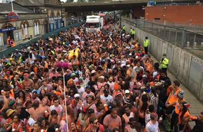 Crowd behind Notting Hill carnival float